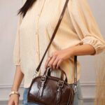 Chestnut Buckle Sling Bag in Brown, view 1