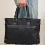 Embossed Laptop Bag with Sling Strap in Black, view 1